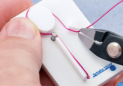 Wire cutters trimming the end of the wire